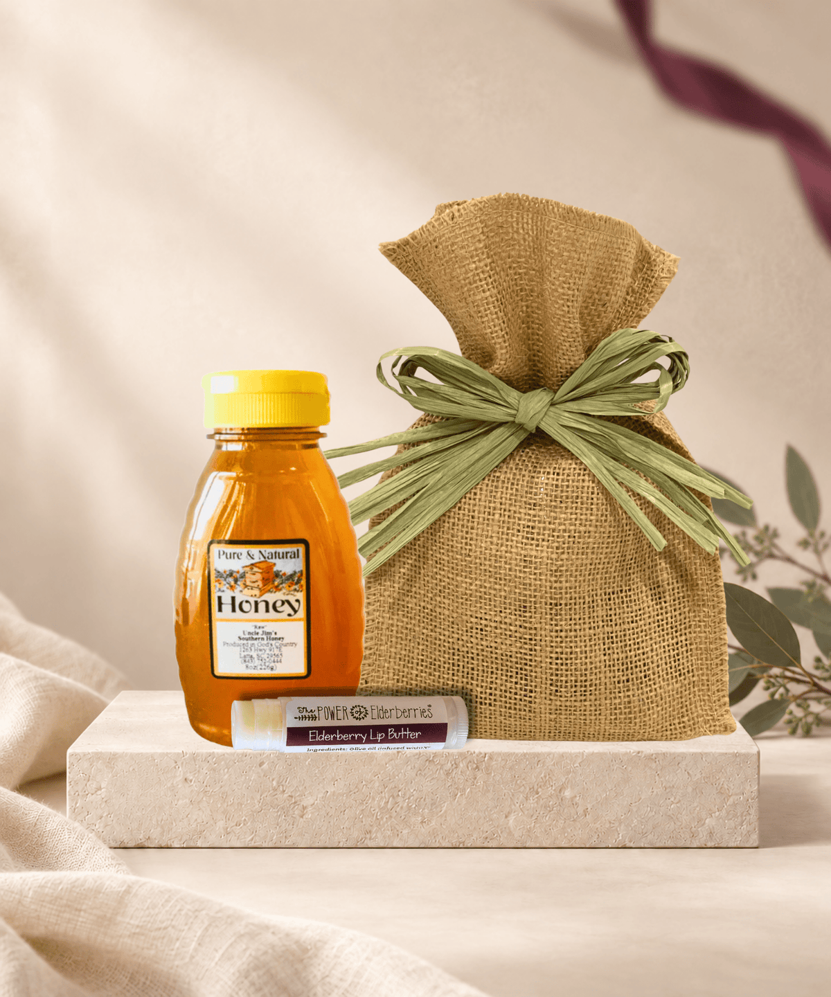 Sweet Little Ritual Gift Set with 8-ounce local raw honey, Elderberry Lip Butter, and a burlap gift bag.