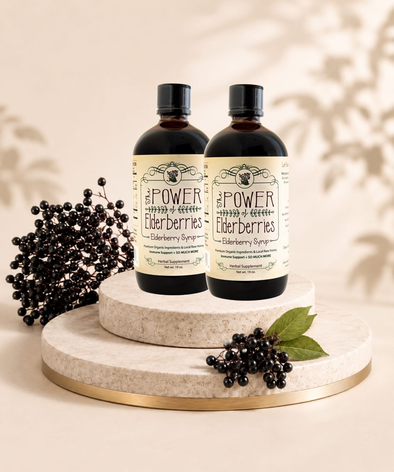 Daily Foundation Bundle two bottles of premium elderberry syrup sitting on a pedestal.