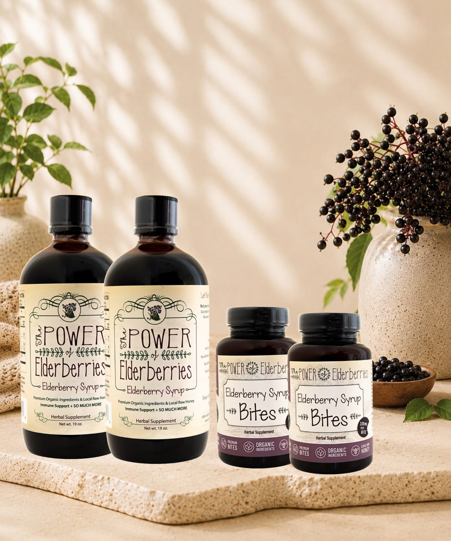 The POWER of Elderberries® Daily Essentials Plus Bundle featuring two elderberry syrups and two elderberry syrup bites bottles for complete daily wellness support.