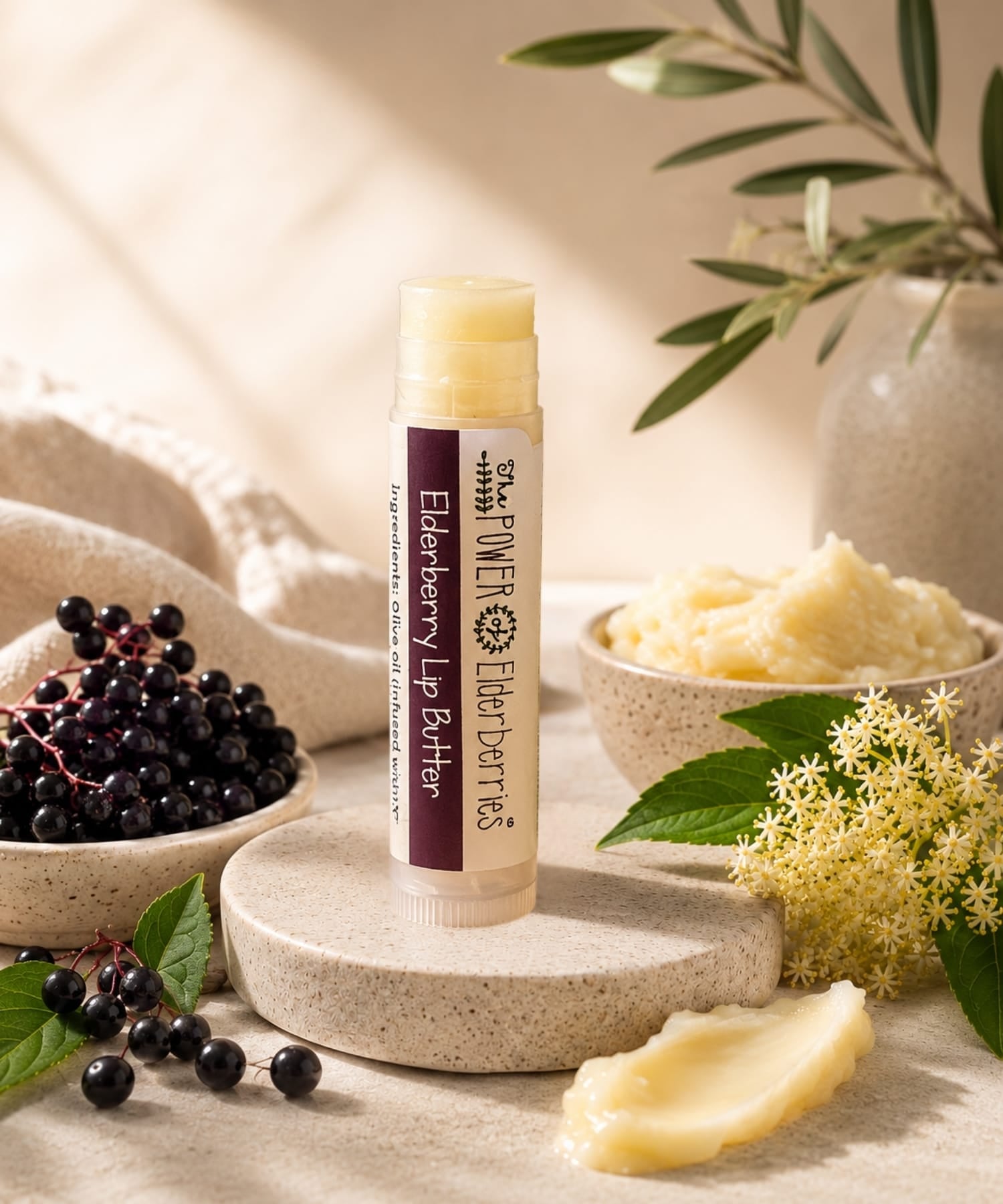 The POWER of Elderberries® Elderberry Lip Butter handcrafted with elderberry-infused olive oil, beeswax, and botanical ingredients.