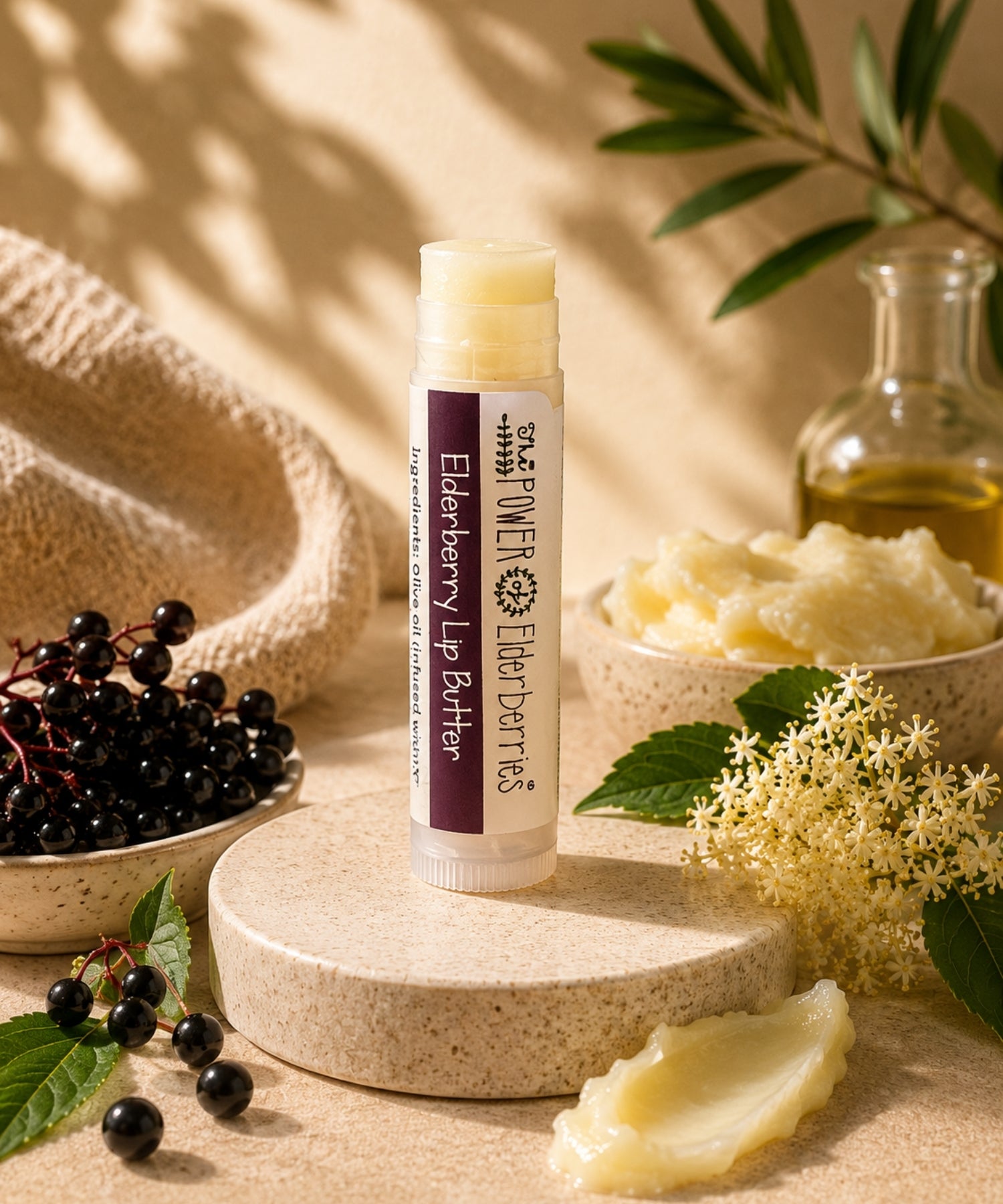 The POWER of Elderberries® Elderberry Lip Butter handcrafted with elderberry-infused olive oil, beeswax, and botanical ingredients.