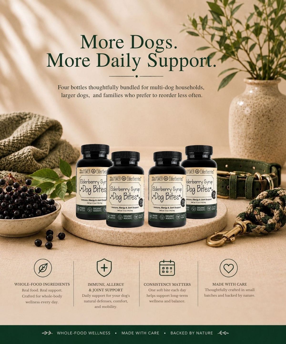 Four bottles of Elderberry Syrup Dog Bites arranged on a beige tabletop with a bowl of elderberries, rope, a vase with greenery.