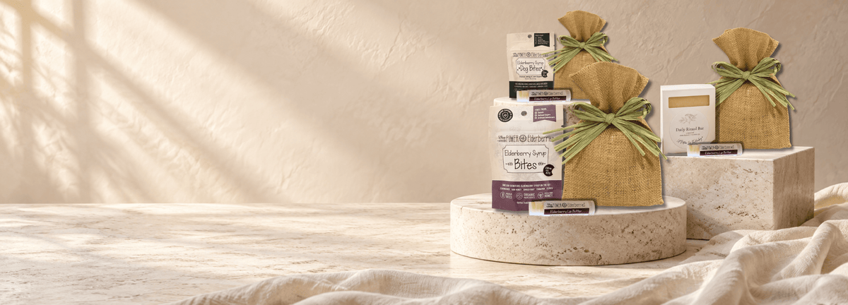 Three ready-to-give Petite Gift Sets featuring human wellness, canine wellness and handcrafted self-care displayed on stone pedestals.