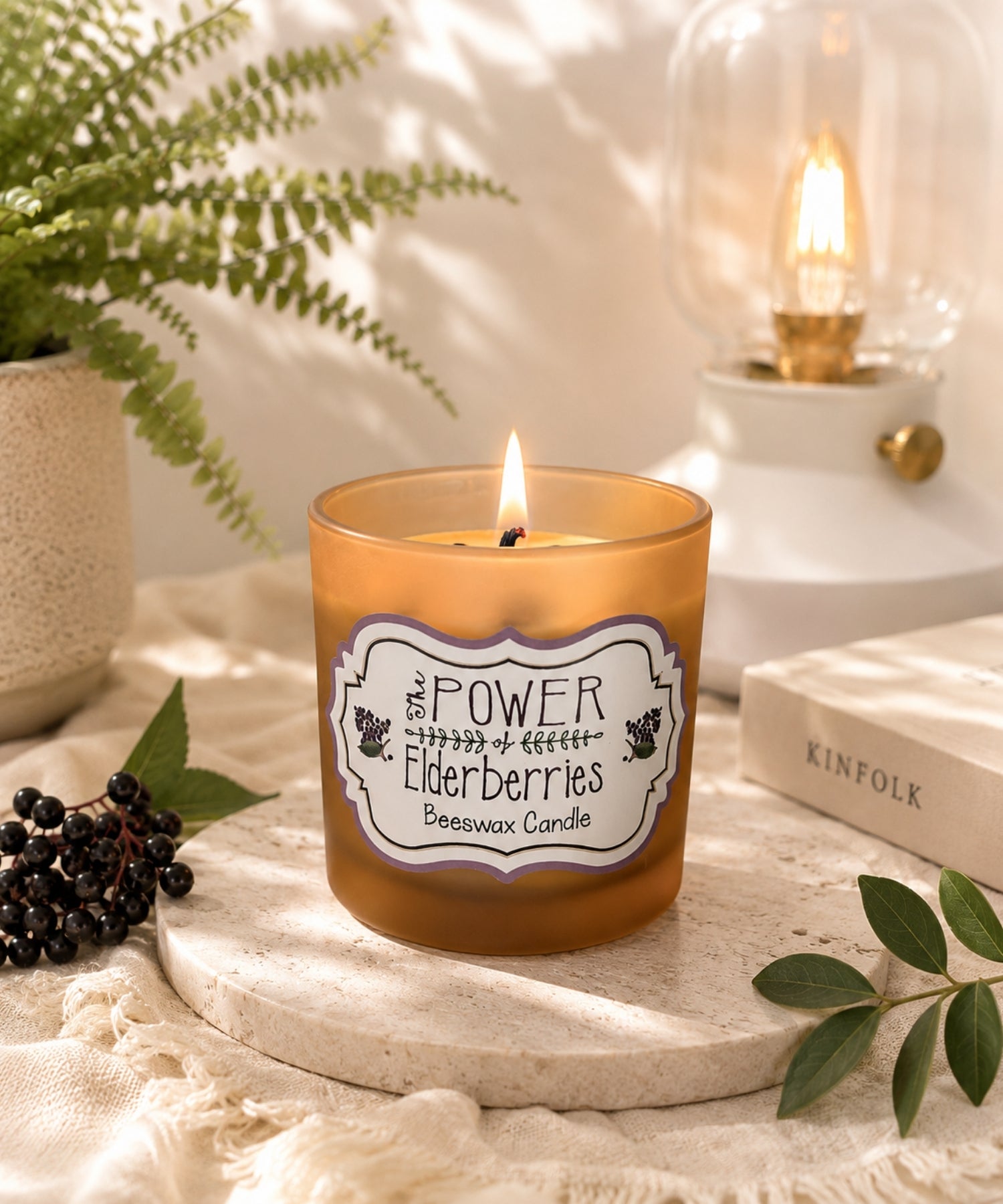 Signature Elderberry Beeswax Candle handcrafted with beeswax and wooden wick in a luxury wellness-inspired setting.