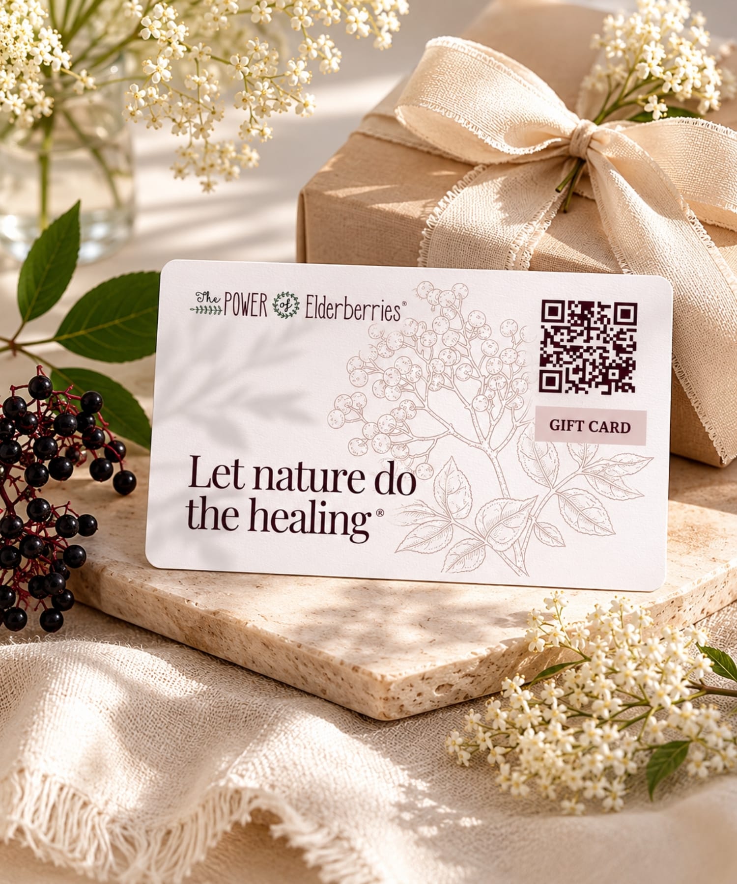 Digital wellness gift card from The POWER of Elderberries® styled with luxury gift wrapping.