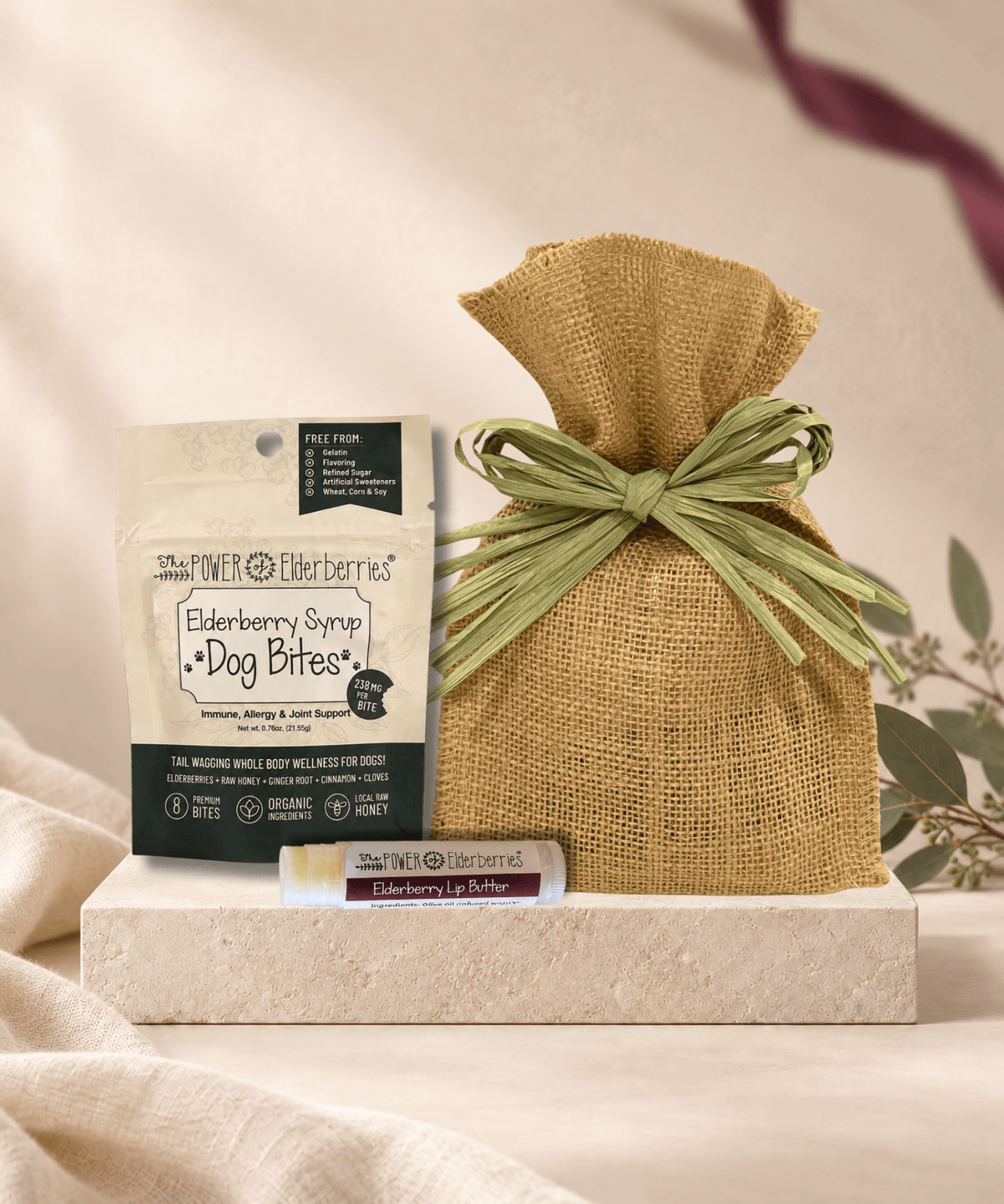 Petite Pup Gift Set with 8-count Elderberry Syrup Dog Bites, Elderberry Lip Butter for the pet parent, and a burlap gift bag.