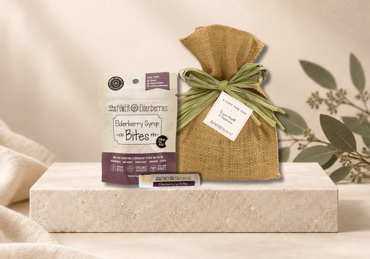 Petite Gift Set presented in a natural burlap bag with a green raffia bow and gift tag.