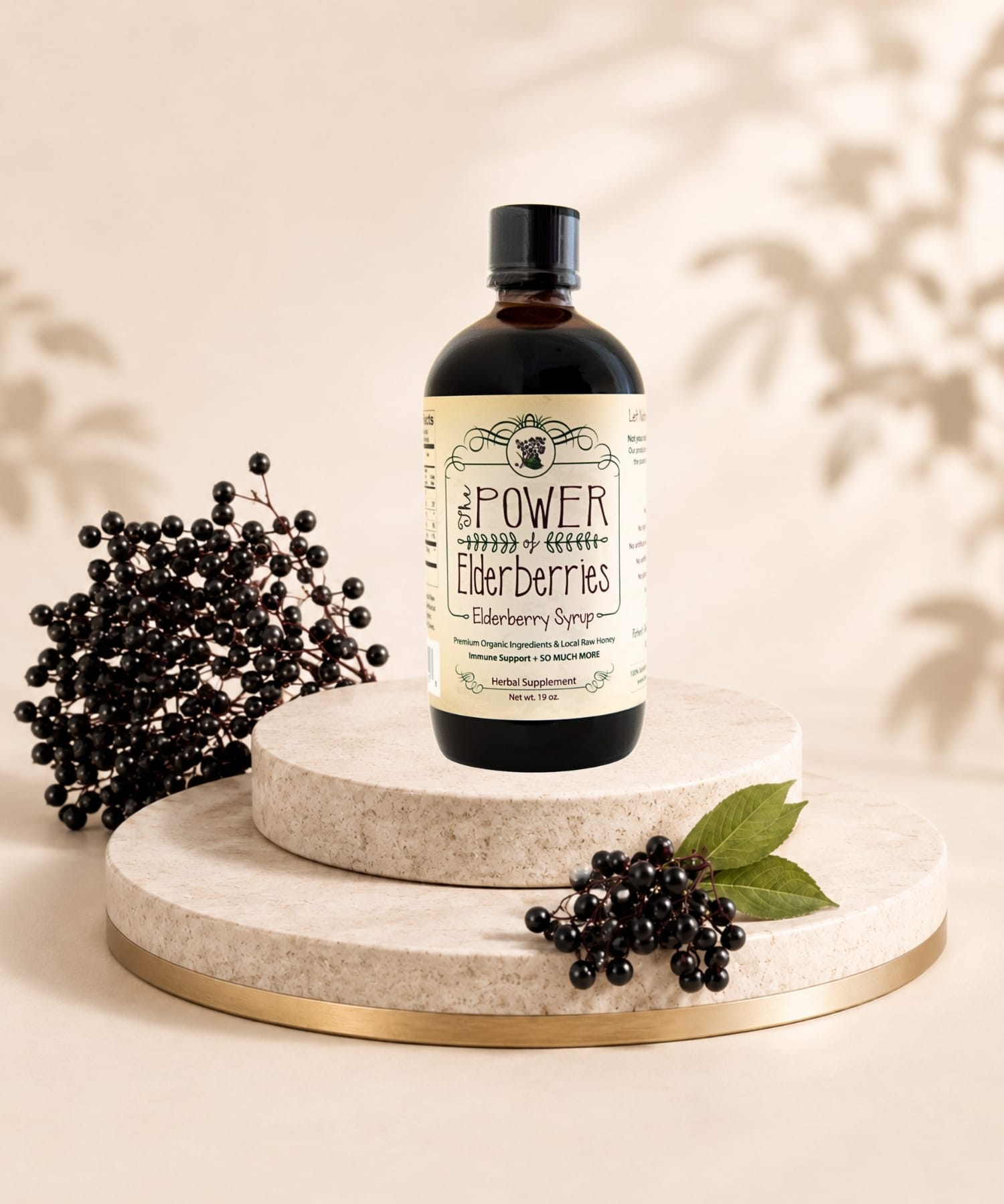 Premium fresh-made elderberry syrup with organic black elderberries, cinnamon sticks, and whole food ingredients sitting on a platform.